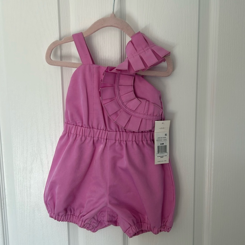 Toddler girl Bloomingdale’s tag on pink romper size 24 months